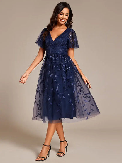 Exquisite midi length Navy Blue dress with ruffled sleeves, tulle fabric, sequin details, and embroidery