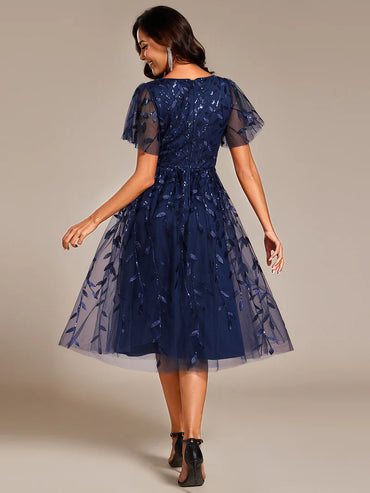 Exquisite midi length Navy Blue dress with ruffled sleeves, tulle fabric, sequin details, and embroidery