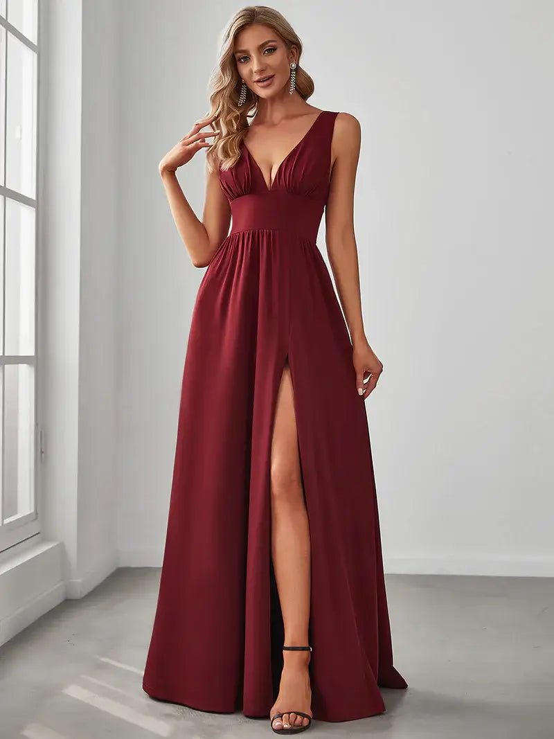 Elegant floor-length evening burgundy dress with V-neck, empire waist, and high slit