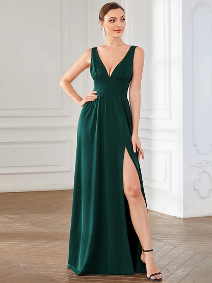 Elegant floor-length evening dark green dress with V-neck, empire waist, and high slit