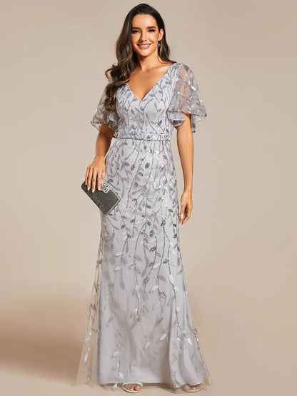 Grey V-neck fishtail party dress with shimmering leaf sequin embellishment.