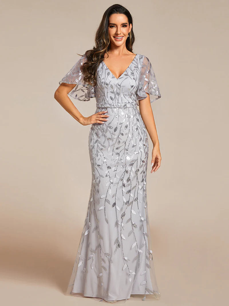 Grey V-neck fishtail party dress with shimmering leaf sequin embellishment.