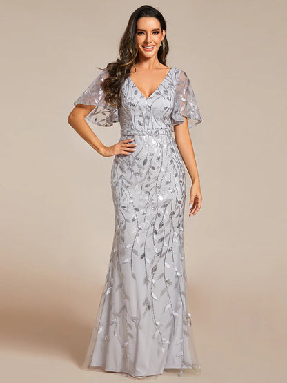 Grey V-neck fishtail party dress with shimmering leaf sequin embellishment.