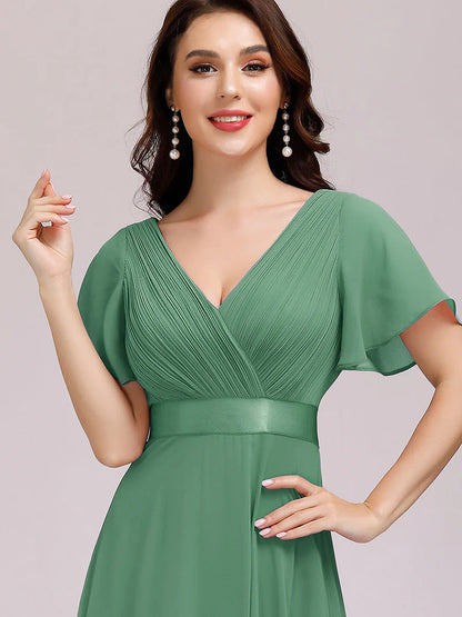 Green bean glamorous evening gown with double V-neckline, ruffle detailing, and padded bodice