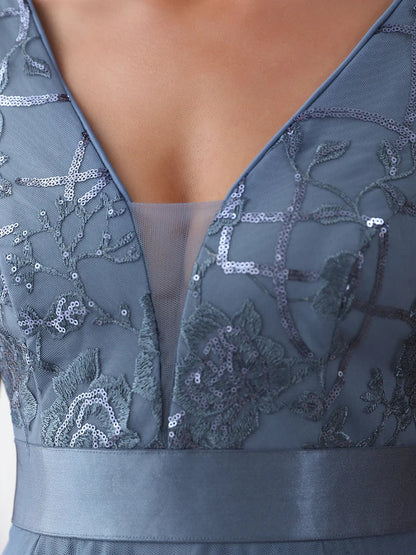 High-low dusty navy tulle prom dress with V-neckline and elegant layered skirt for formal events