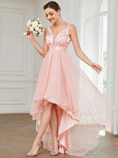 High-low pink tulle prom dress with V-neck and sequin appliques, perfect for formal events