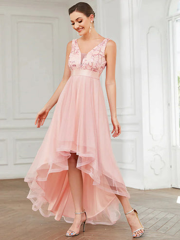 High-low pink tulle prom dress with V-neck and sequin appliques, perfect for formal events