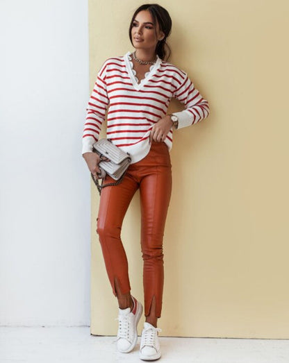High-waisted orange leggings for women, stretchy and comfortable activewear displayed on flat surface