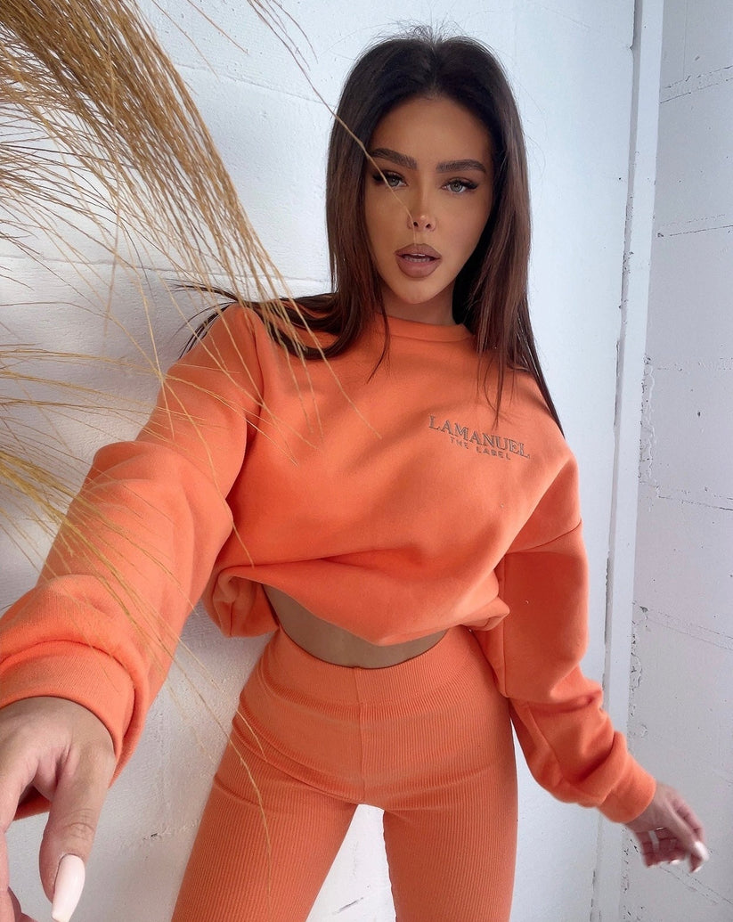 Issamatch orange tracksuit, vibrant two-piece set perfect for sporty style