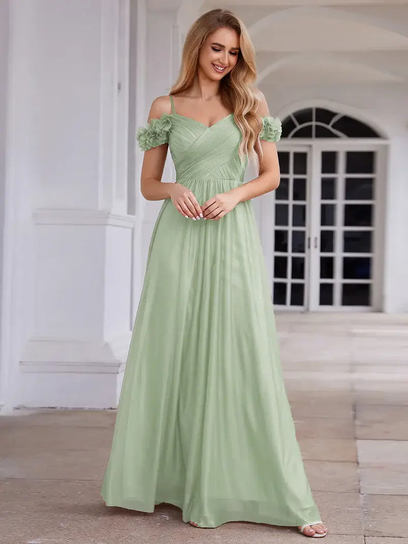 Glamorous sequin gown featuring off-the-shoulder sleeves, sweetheart bodice, and floral accents mint green dress