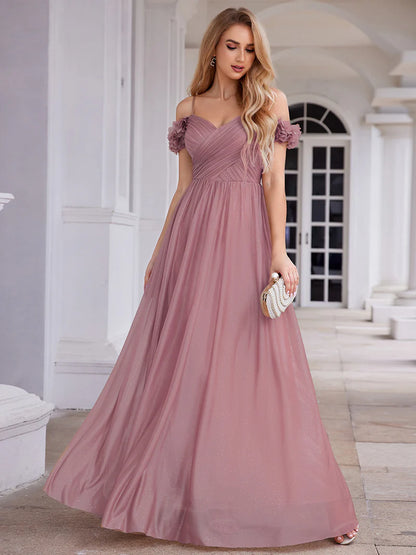 Glamorous sequin gown featuring off-the-shoulder sleeves, sweetheart bodice, and floral accents orhid dress