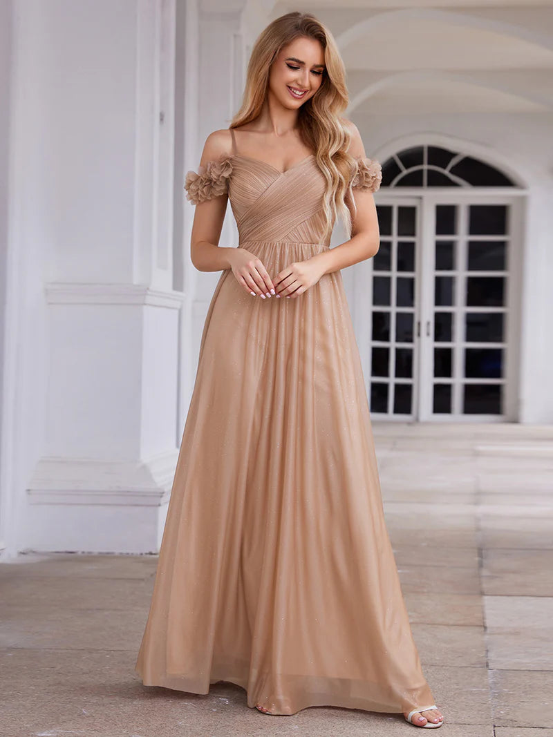 Glamorous sequin gown featuring off-the-shoulder sleeves, sweetheart bodice, and floral accents rose gold dress
