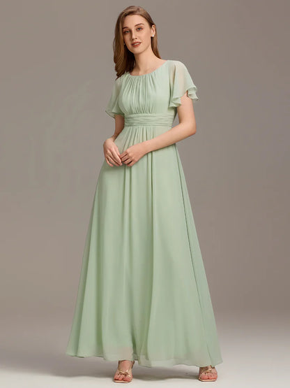 Round neck mint green bridesmaid gown in a pleated design for elegant wedding looks