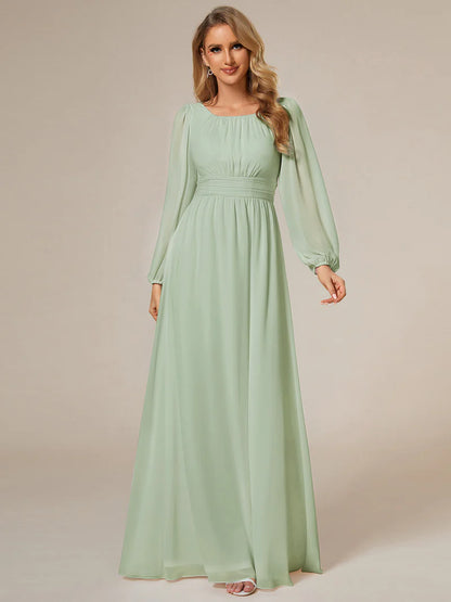 Mint green bridesmaid dress with round neckline and long lantern sleeves