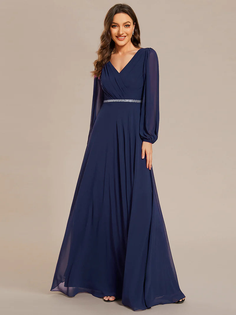 Navy blue elegant chiffon guest dress with V-neckline, long sleeves, and a fitted waist