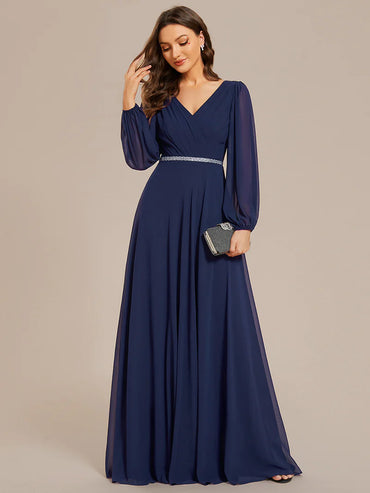 Navy blue elegant chiffon guest dress with V-neckline, long sleeves, and a fitted waist