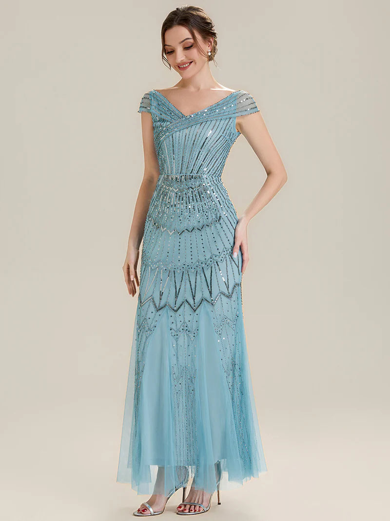 Woman wearing a sky blue sequin dress 