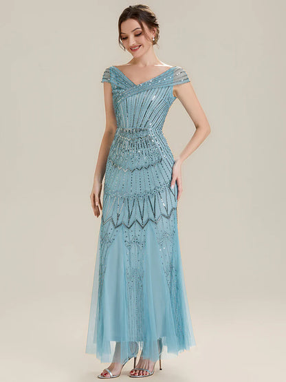 Woman wearing a sky blue sequin dress 