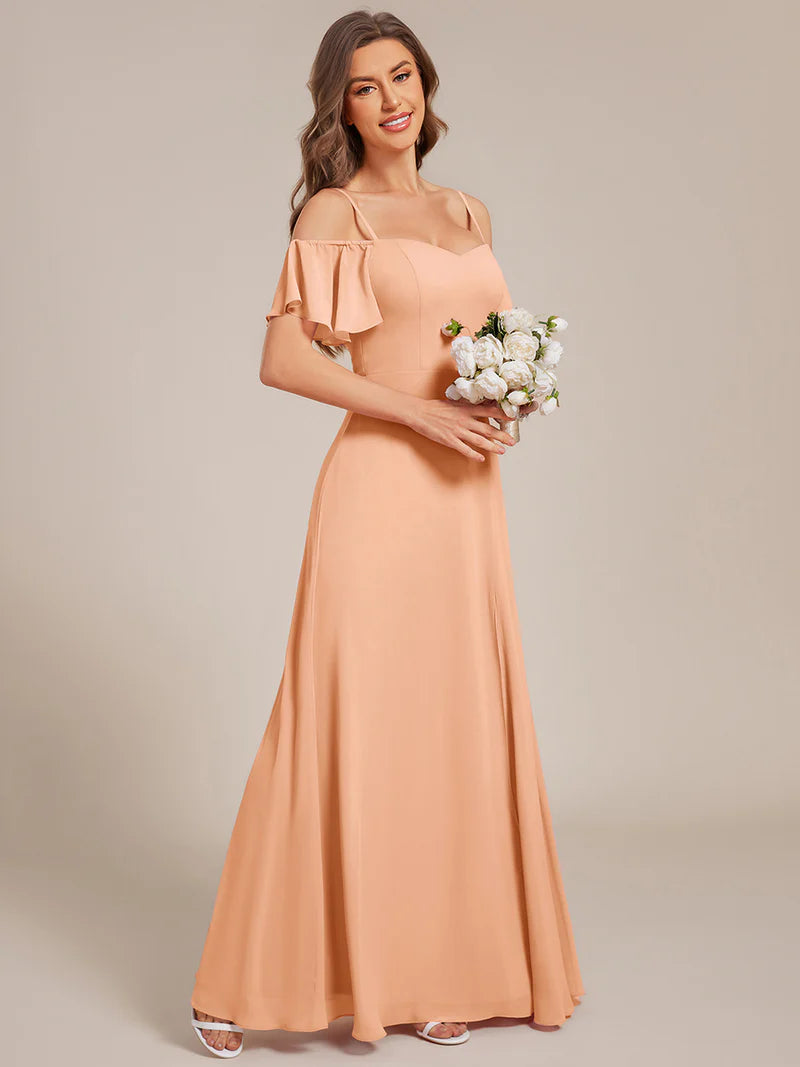 Peach chiffon bridesmaid dress with high side slit and delicate spaghetti straps