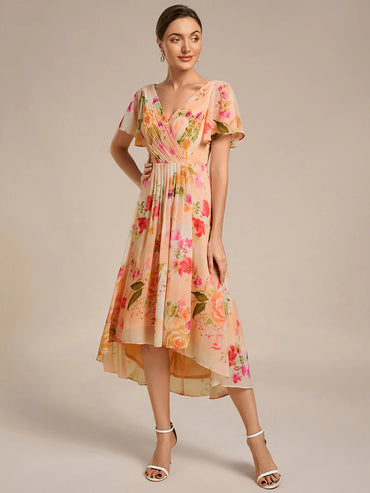 Peach fuzz elegant chiffon wedding guest dress with pleated bodice and ruffle detailing