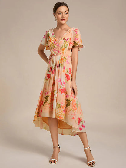Peach fuzz elegant chiffon wedding guest dress with pleated bodice and ruffle detailing