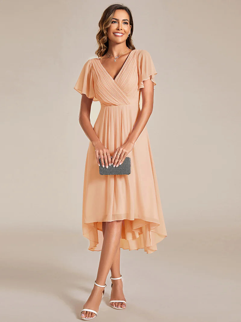 Peach elegant chiffon wedding guest dress with pleated bodice and ruffle detailing