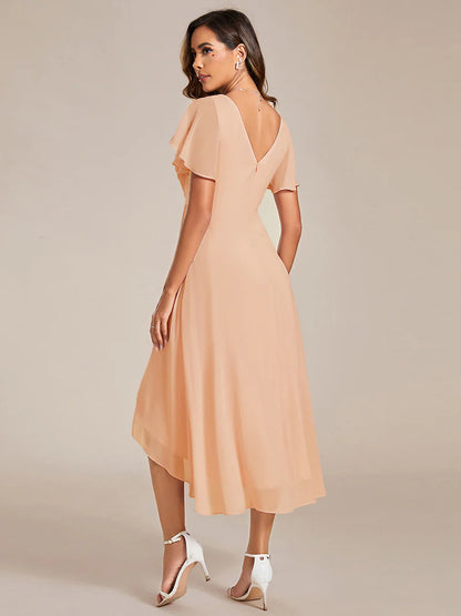 Peach elegant chiffon wedding guest dress with pleated bodice and ruffle detailing