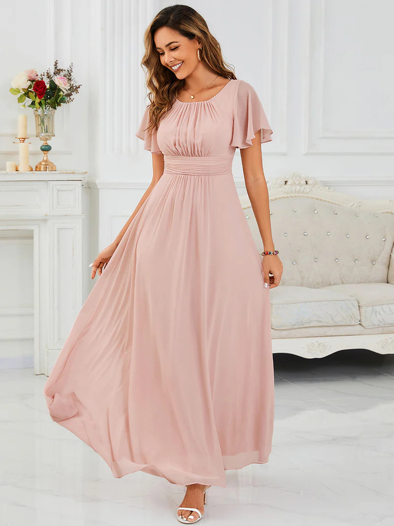Round neck pink bridesmaid gown in a pleated design for elegant wedding looks