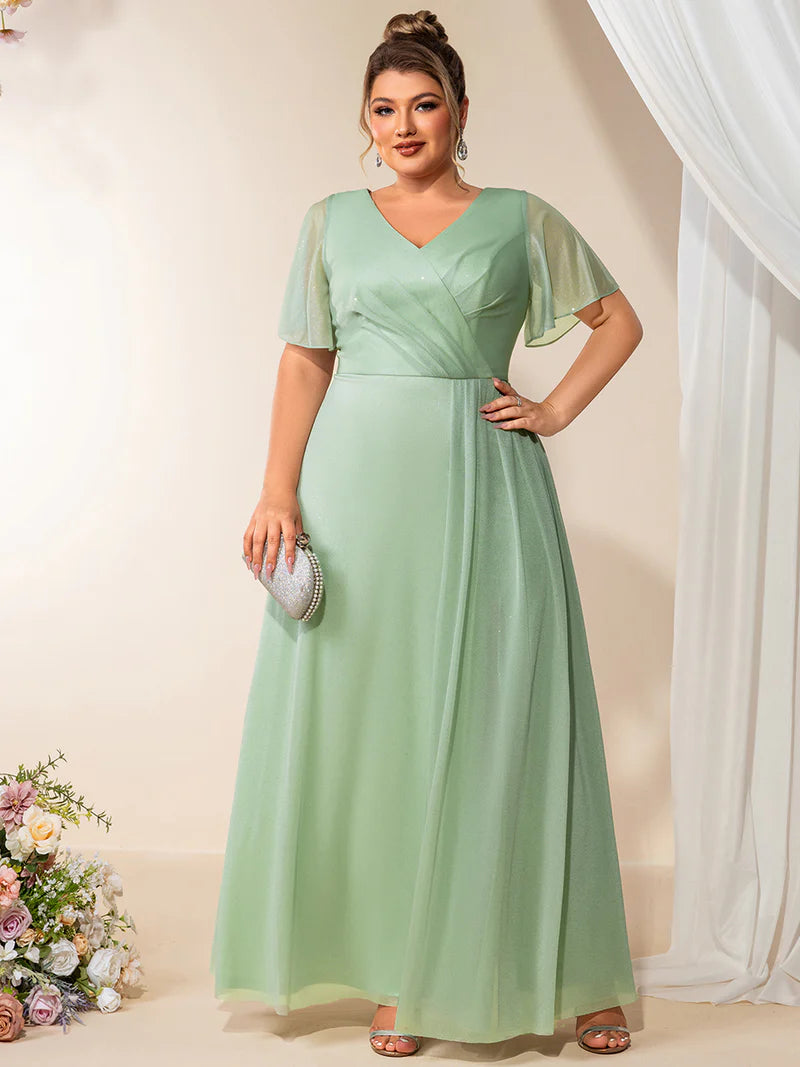 Plus size mint green evening dress with ruffle V-neckline, A-line silhouette, and short sleeves
