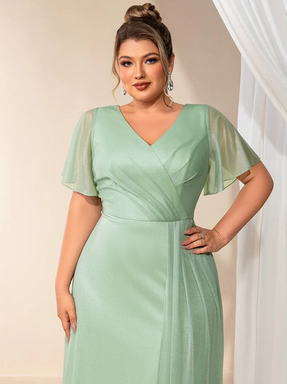 Plus size mint green evening dress with ruffle V-neckline, A-line silhouette, and short sleeves