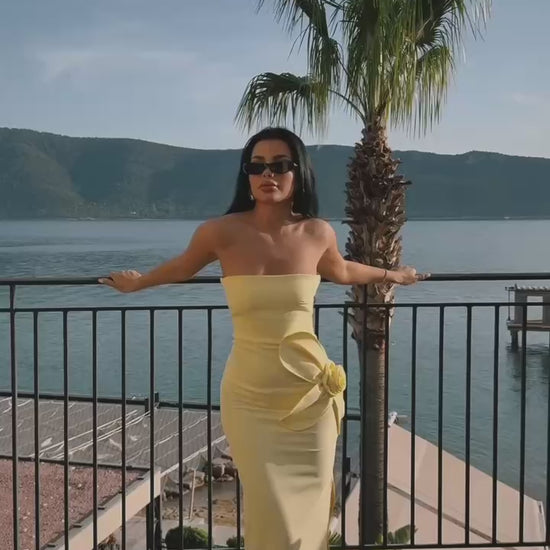 Strapless yellow maxi dress with 3D floral detailing and elegant side slit