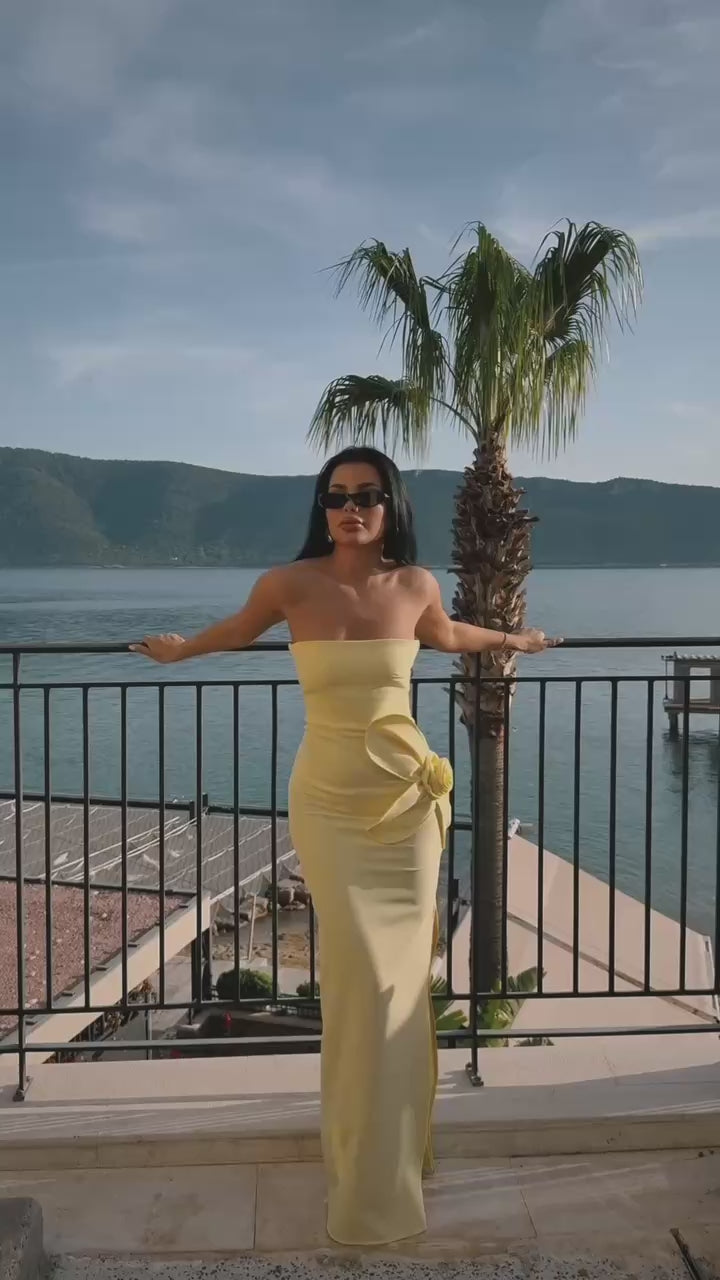 Strapless yellow maxi dress with 3D floral detailing and elegant side slit