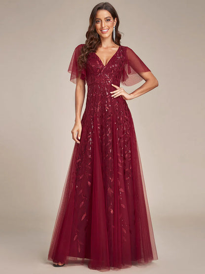 Romantic shimmery evening gown with V-neckline, ruffle sleeves, and floor-length maxi silhouette burgundy dress