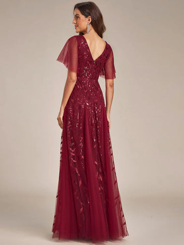Romantic shimmery evening gown with V-neckline, ruffle sleeves, and floor-length maxi silhouette burgundy dress