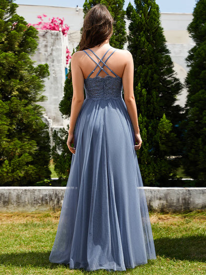 Romantic tulle dusty blue bridesmaid dress with spaghetti straps, lace halter neckline, and open back