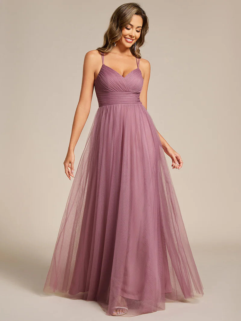 Romantic purple orchid bridesmaid dress with spaghetti straps, lace halter neckline, and open back