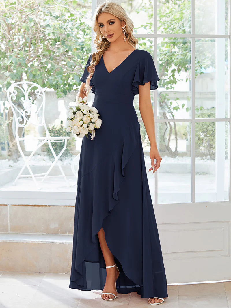 Elegant navy blue chiffon high-low gown for bridesmaids featuring V-neck and soft ruffles