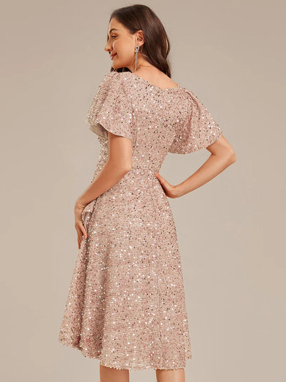 Elegant sequin high-low formal champagne dress featuring short ruffle sleeves and a deep V-neckline – ideal for weddings, galas, or prom nights.