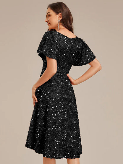 Elegant sequin high-low formal black dress featuring short ruffle sleeves and a deep V-neckline – ideal for weddings, galas, or prom nights.