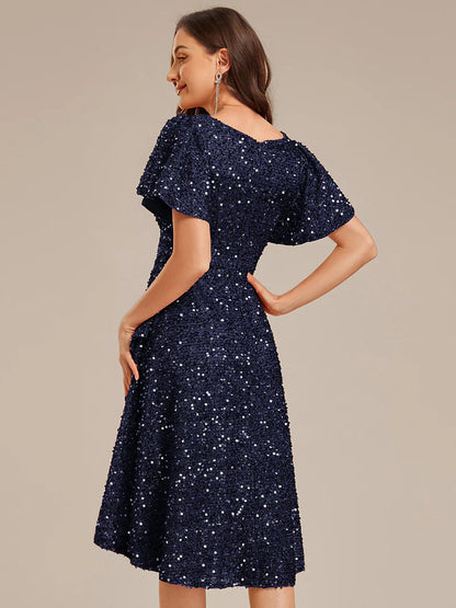 Elegant sequin high-low formal navy blue dress featuring short ruffle sleeves and a deep V-neckline – ideal for weddings, galas, or prom nights.