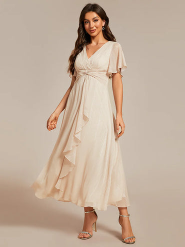 Shimmering V-neck tea length Charcoal dress with short sleeves, perfect for wedding guests