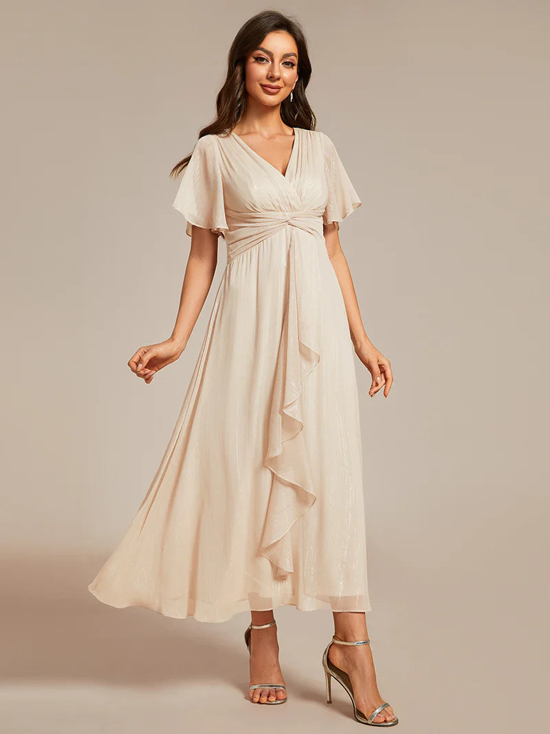 Shimmering V-neck tea length Charcoal dress with short sleeves, perfect for wedding guests