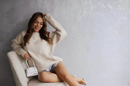 Thick smooth cozy beige sweater, warm and comfortable knitwear for everyday wear