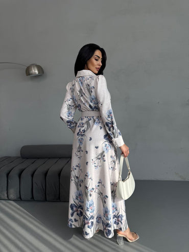 Vintage-inspired floral maxi dress with long sleeves and belted waist