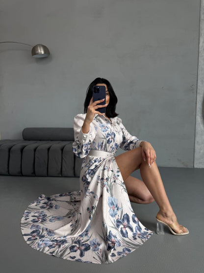 Vintage-inspired floral maxi dress with long sleeves and belted waist