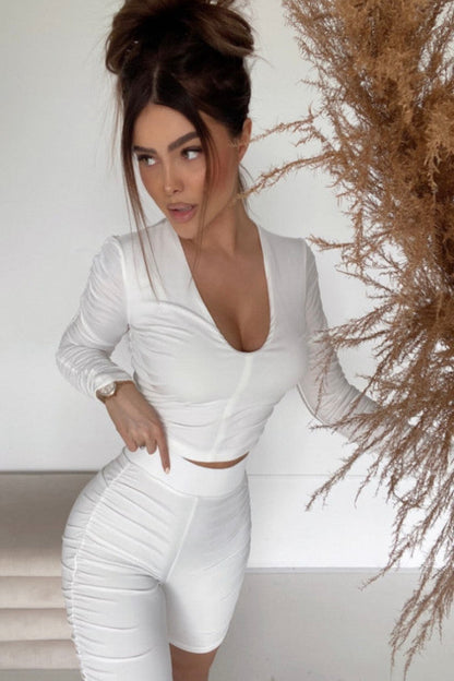 White ruffled two-piece set featuring a boyfriend-style shirt and matching shorts