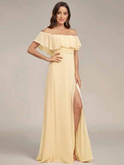 Yellow bridesmaid dress with ruffle detailing and thigh-high split