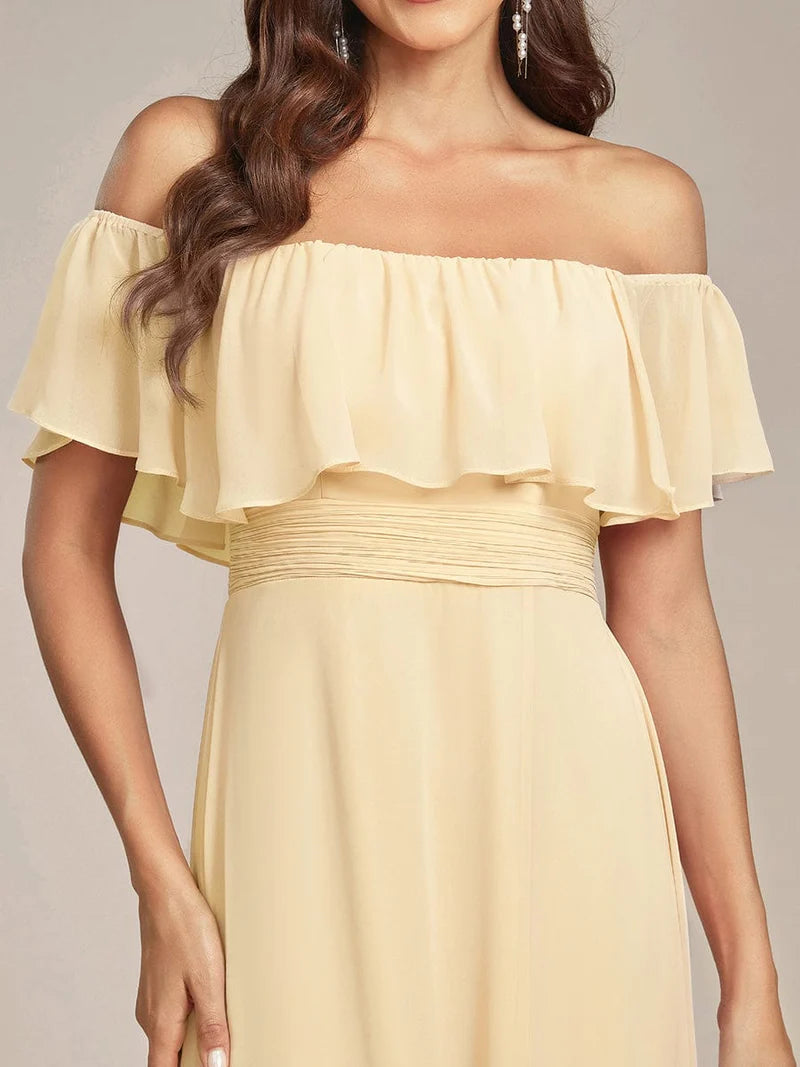 Yellow bridesmaid dress with ruffle detailing and thigh-high split