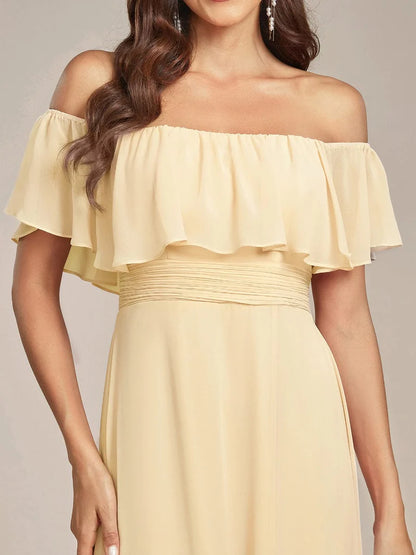 Yellow bridesmaid dress with ruffle detailing and thigh-high split